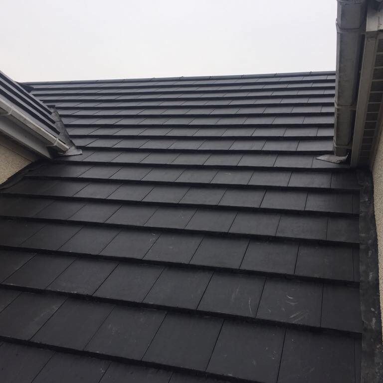 New grey slate roof on family home