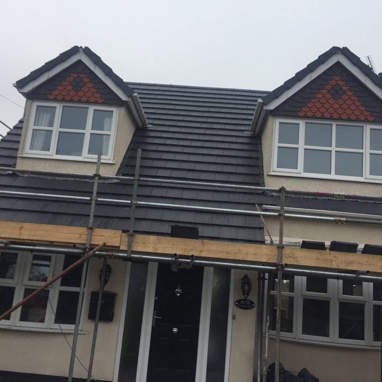 House with new grey slate roofing