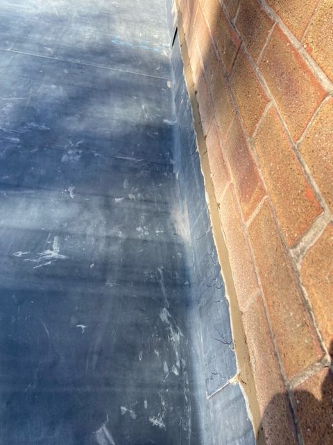 EPDM Rubber Roofing edge to brick wall